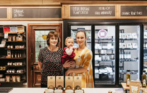 A photo of Julia with her mother and child.