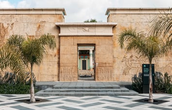 The tall sandstone-coloured walls at the entrance to the Ancient Egyptian Garden.