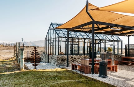 A large glasshouse outside Carrick Winery Bannockburn Central Otago.