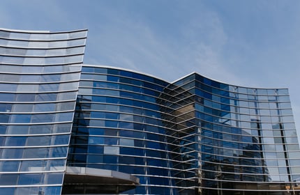 Exterior curved glass building of the Christchurch Art Gallery.