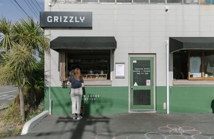A woman orders at the Grizzly Baked Goods window in Christchurch.