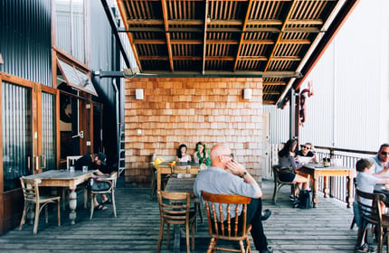 Customers hanging out on the deck at Lyttelton Coffee Company cafe.