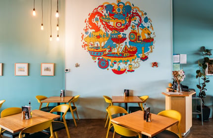 A colourful mural on the wall inside Passo.