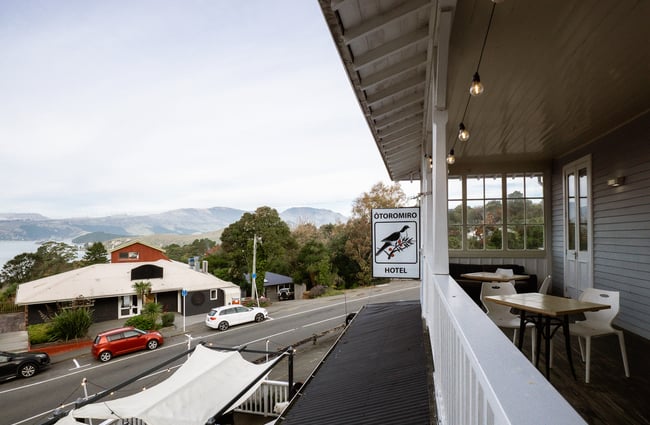 Outside area with sign for the hotel at Ōtoromiro Hotel, Governors Bay.