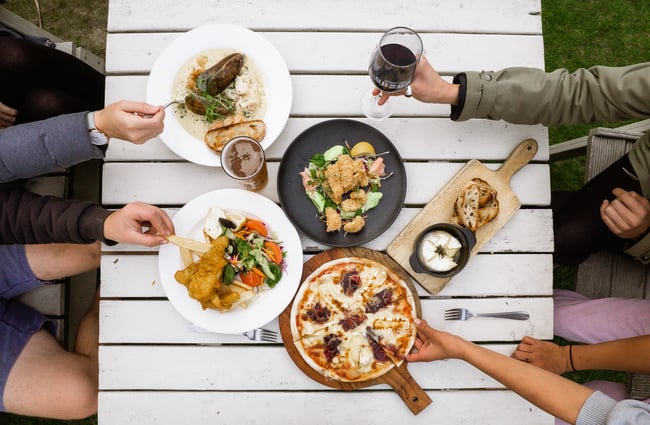 A Birdseye view of food on a table outside.