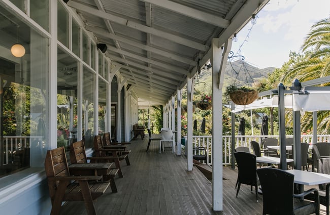 Veranda with seating at Ōtoromiro Hotel, Governors Bay.