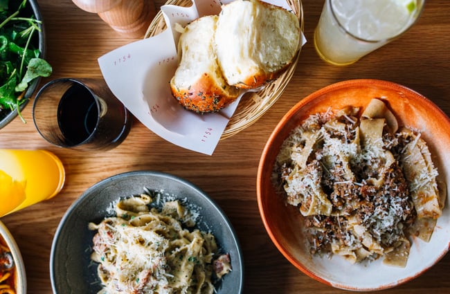 A table full of pasta dishes at 1154, Wellington.