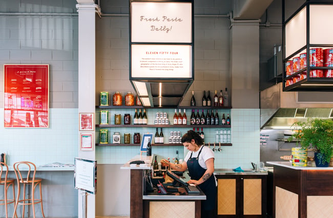 A worker at the counter in 1154, Wellington.