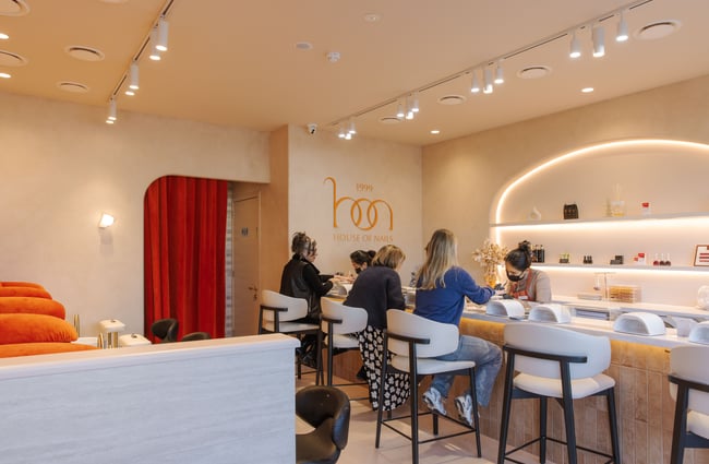 Clients sitting up at the nail bar getting their manicures done at 1999 House of Nails Ferrymead.