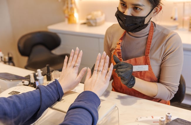 Customer admiring her nails at 1999 House of Nails Ferrymead.
