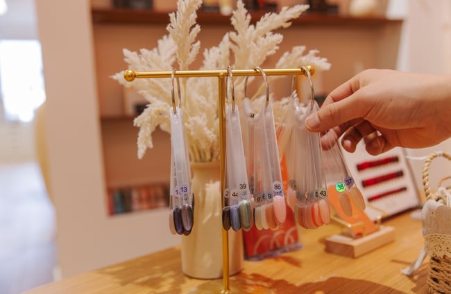 Customer selecting a nail colour at 1999 House of Nails - Manchester Street.