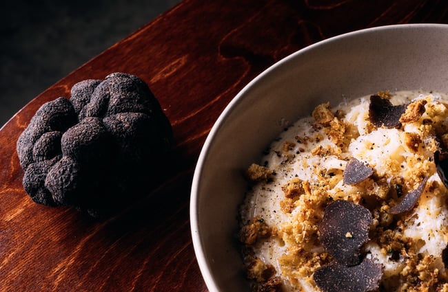 Close up of a black truffle and dish with shaved truffle at 5th Street restaurant Christchurch.