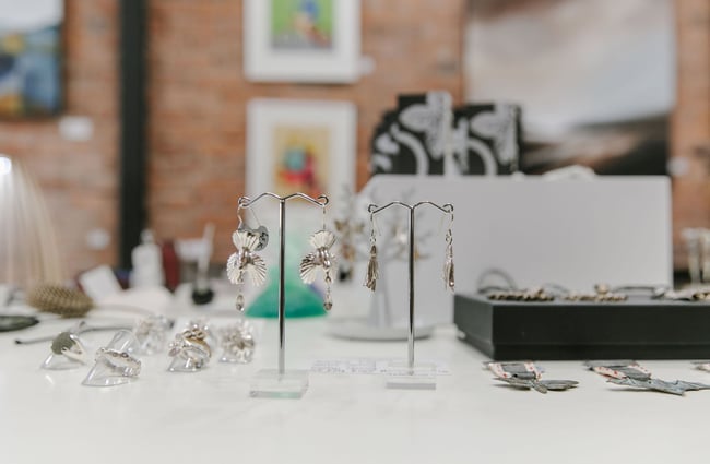 Silver earrings on display at 77 Art + Living in Fairlie.
