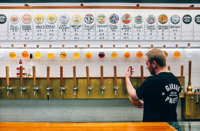 A man pouring beer.