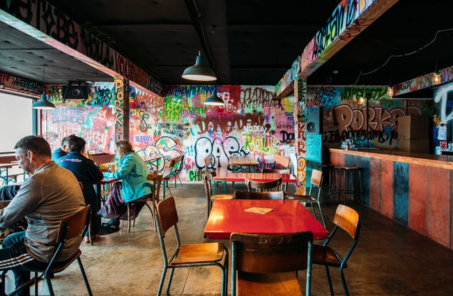 The interior of the Abandoned Brewery with graffiti covered walls.