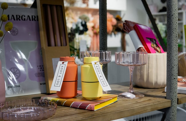 A close up of flasks and wine glasses on display.