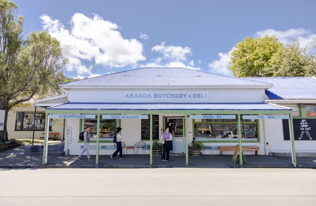 Charming exterior of Akaroa Butchery & Deli on a sunny day