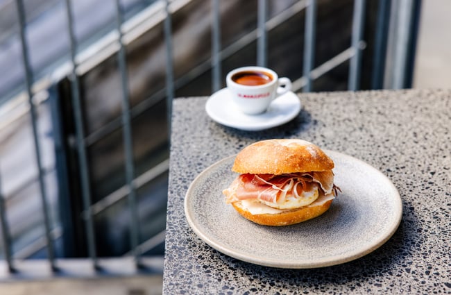Prosciutto roll on table at Allpress Auckland Roastery