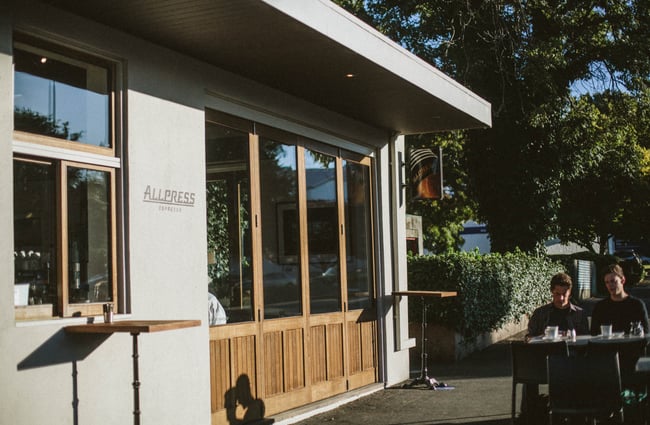 Two customers dining outside.