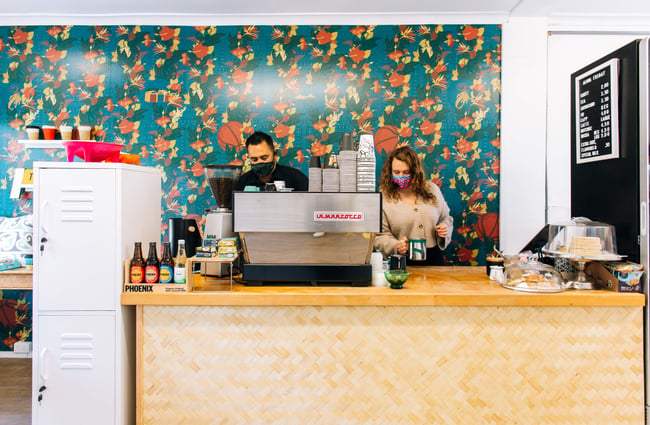 Two baristas behind the counter at Aloha Friday, Porirua.