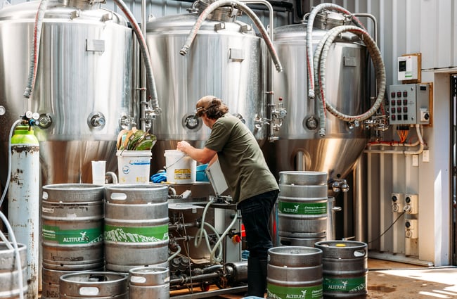 A man brewing beer at Altitude.