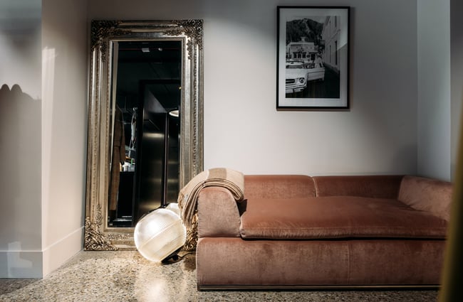 A soft couch in the dressing room of Angel Divine in Queenstown.