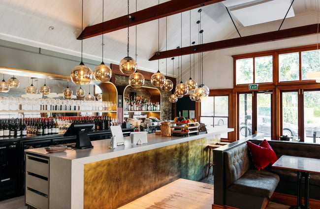 Large light bulbs hanging above the kitchen at Aosta Arrowtown.