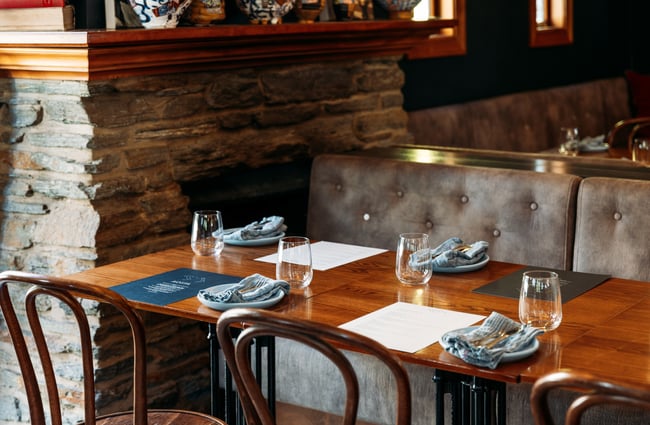 A close up of a table setting in a restaurant.