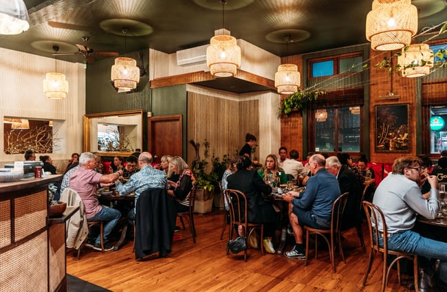 Wide shot of diners in the dining room at Apache.