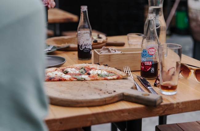Half eaten pizza on the table at Arbour in Lyttelton.