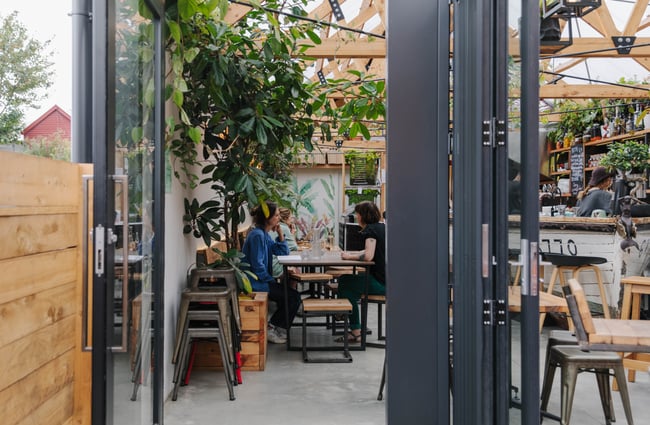 Looking through the door into Arbour Woodfire Pizza in Lyttelton.