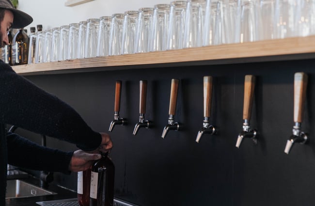 Beer being poured into bottles.