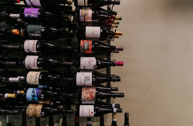 Bottles of wine on the rack at Porta Via.