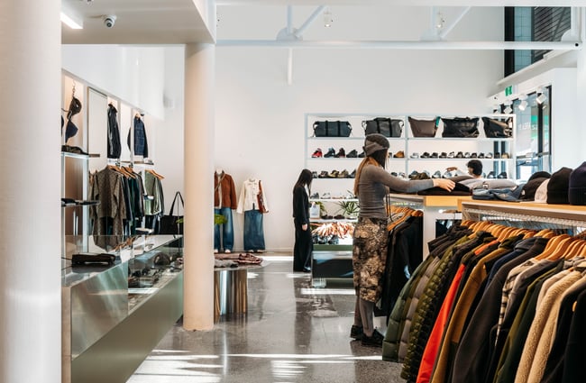 Two people browsing the racks at Area51 in Wellington.