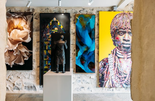 Artworks on the wall at Artbay Gallery in Queenstown.