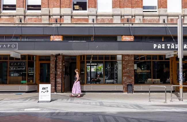 Ashe gallery building exterior with person walking past.