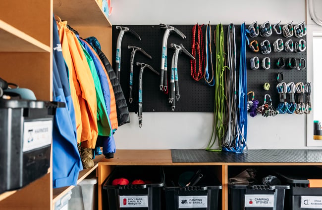 Climbing equipment hanging on the wall in Aspiring Guides.