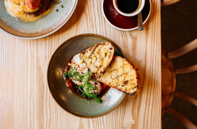 A flatly of bread and eggs on a plate.