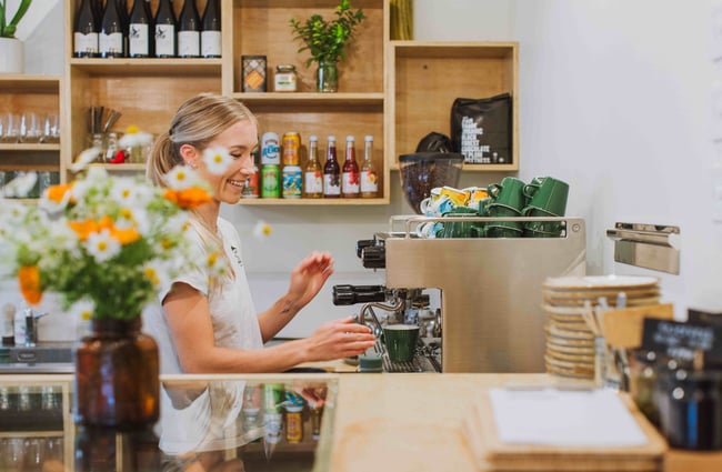 Barista at the coffee machine at Augustines of Portobello.
