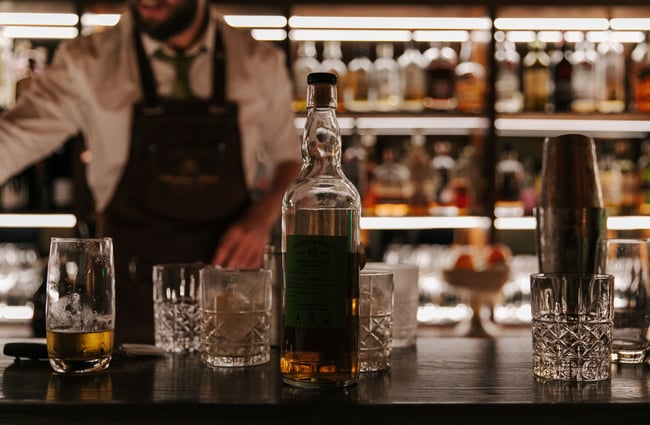 Whiskey glasses on the bar top at Austin Club in Christchurch.