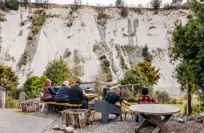 People sitting outside at Awastone in Rangitikei.