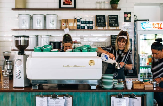 Coffee machine and baristas working.