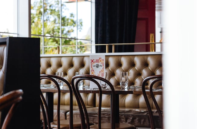 Set table with leather booth seating.
