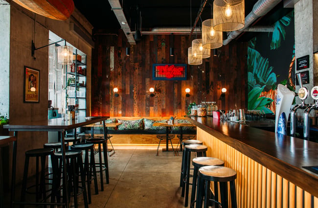 The bar at Banh Mi restaurant with wooden slats covering the front of the bar.