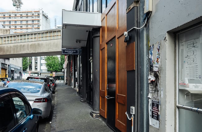 Black and brown doors external leading to the bar.