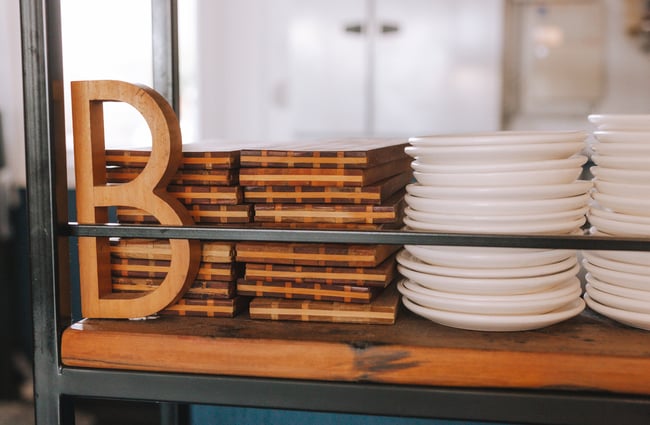 Stacks of plates and chopping boards at Bar Martin, Auckland.