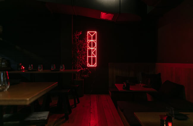 A lit up 'Bar Yoku' sign.