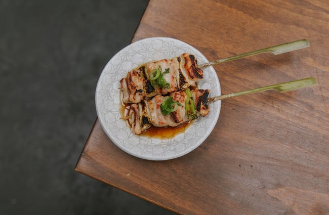 Chicken skewers on a table.