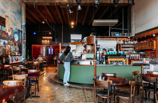 Customer ordering at the front counter at Barista.