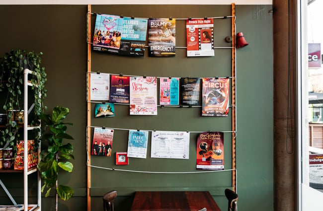 Magazines hanging on a rack at Barista.